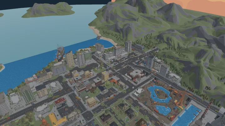 In-engine aerial preview of Apocalypse City, with ruined city blocks, a waterfront and roads between the buildings